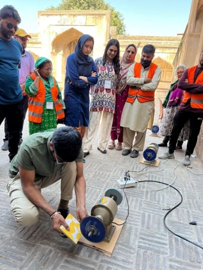 Demonstration of conservation equipment during a knowledge-sharing session.