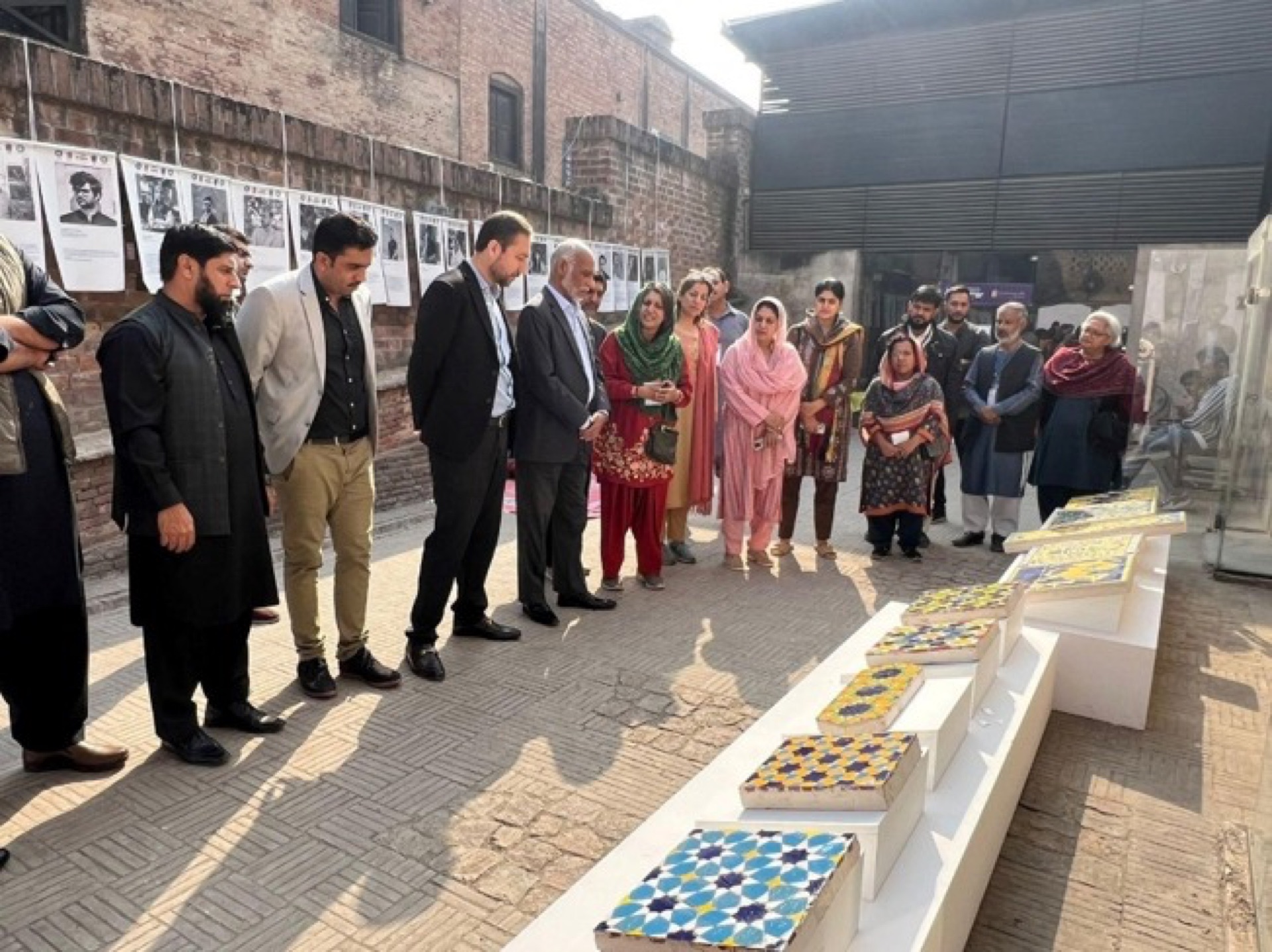 Closing ceremony of the conservation workshop at Lahore Fort with certificate distributions, documentary screening, and exhibition viewing — attended by officials, artists, and CROMLahore members.