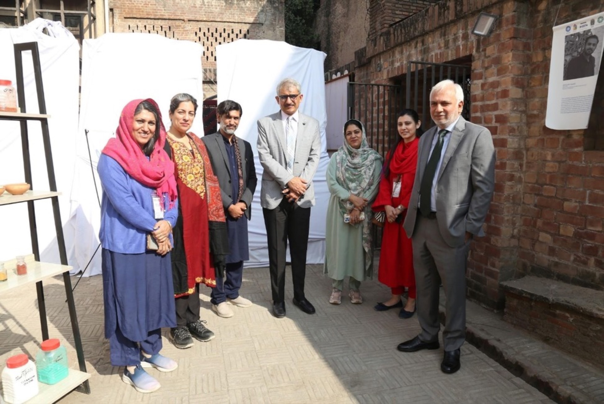 Closing ceremony of the conservation workshop at Lahore Fort with certificate distributions, documentary screening, and exhibition viewing — attended by officials, artists, and CROMLahore members.