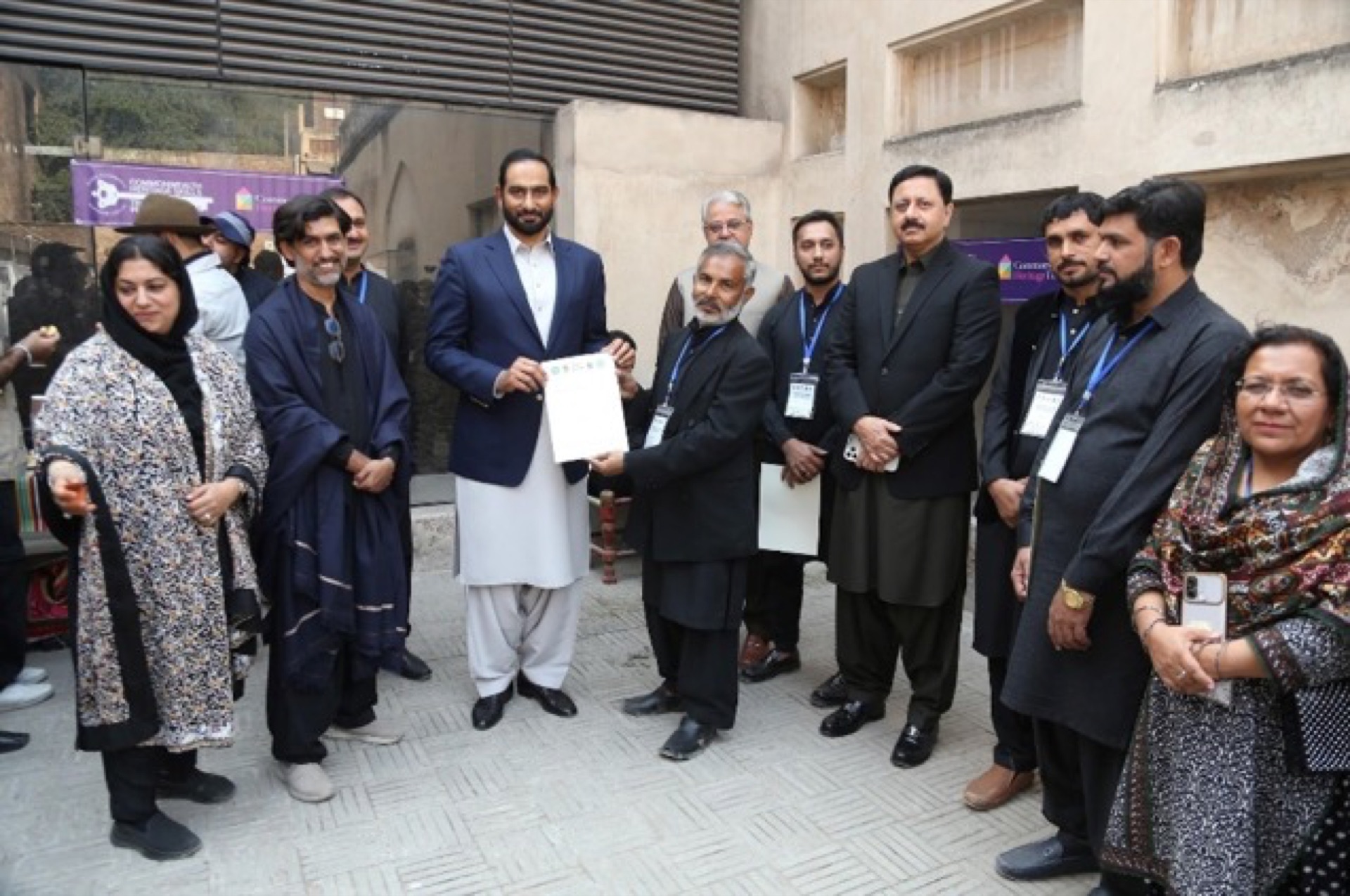 Closing ceremony of the conservation workshop at Lahore Fort with certificate distributions, documentary screening, and exhibition viewing — attended by officials, artists, and CROMLahore members.