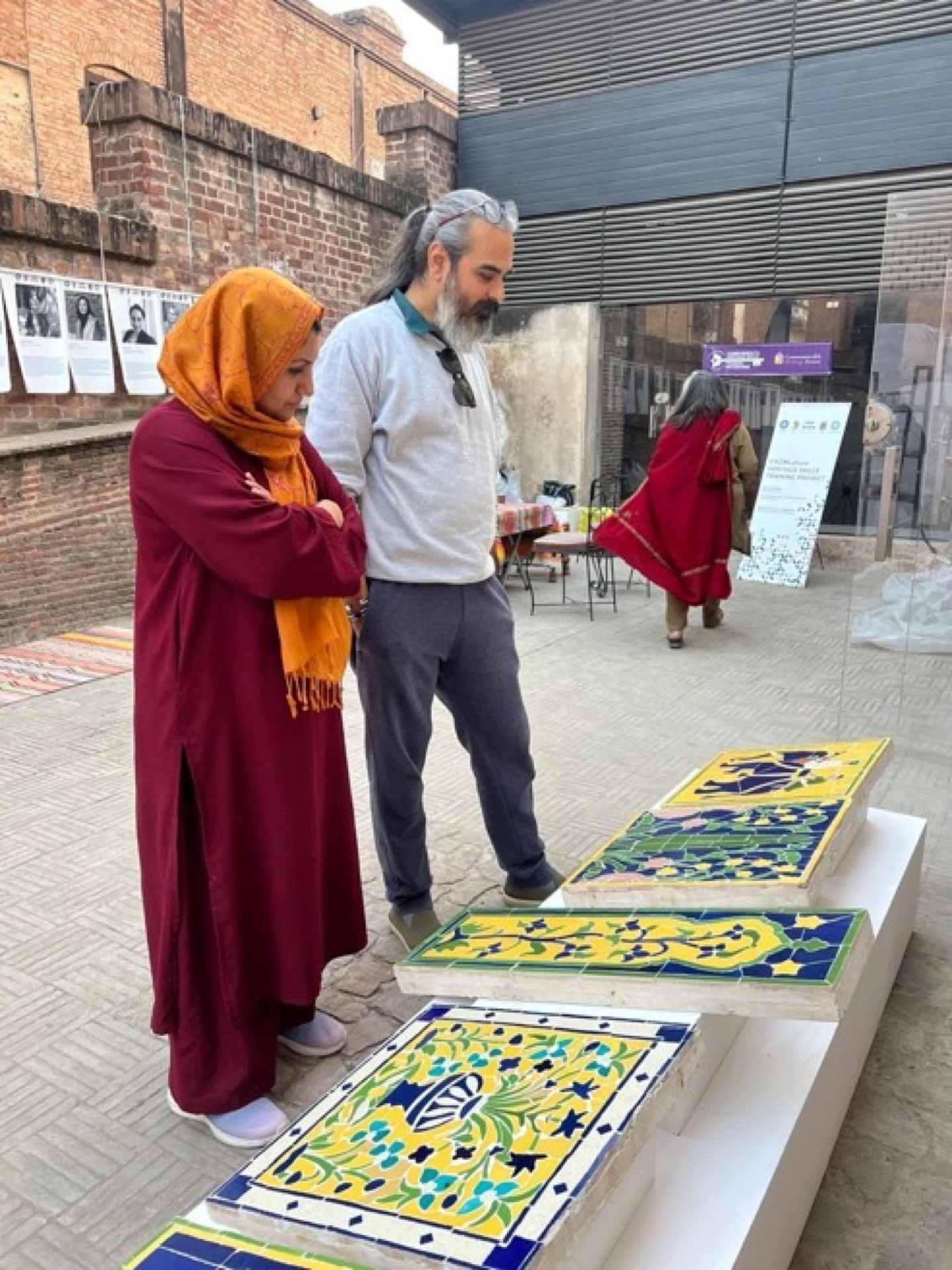 Closing ceremony of the conservation workshop at Lahore Fort with certificate distributions, documentary screening, and exhibition viewing — attended by officials, artists, and CROMLahore members.