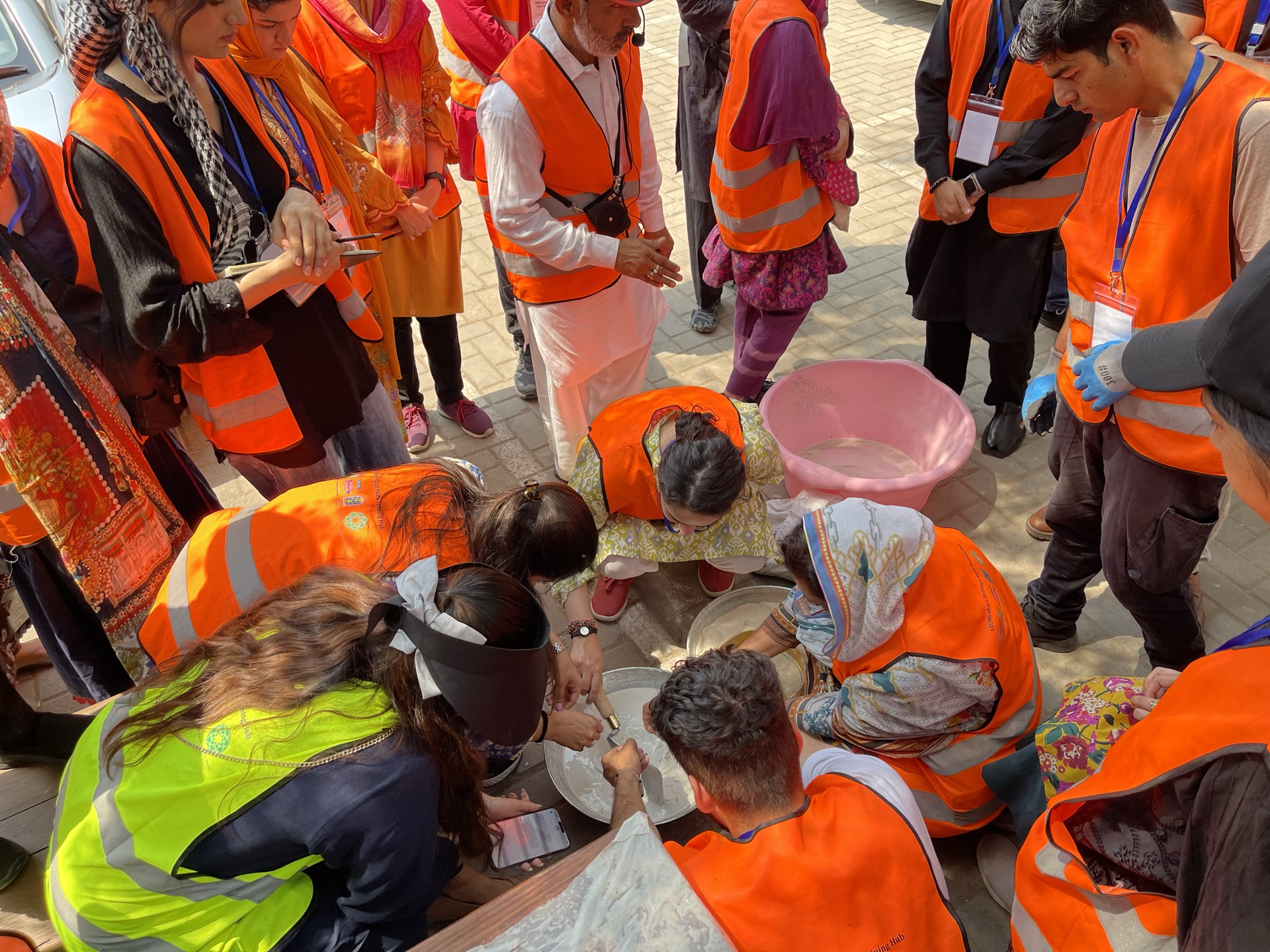 Hands-on lime practice with Lime Expert Ms. Catherine Woolfitt: mixing mortars, repointing, and casting lime slabs.