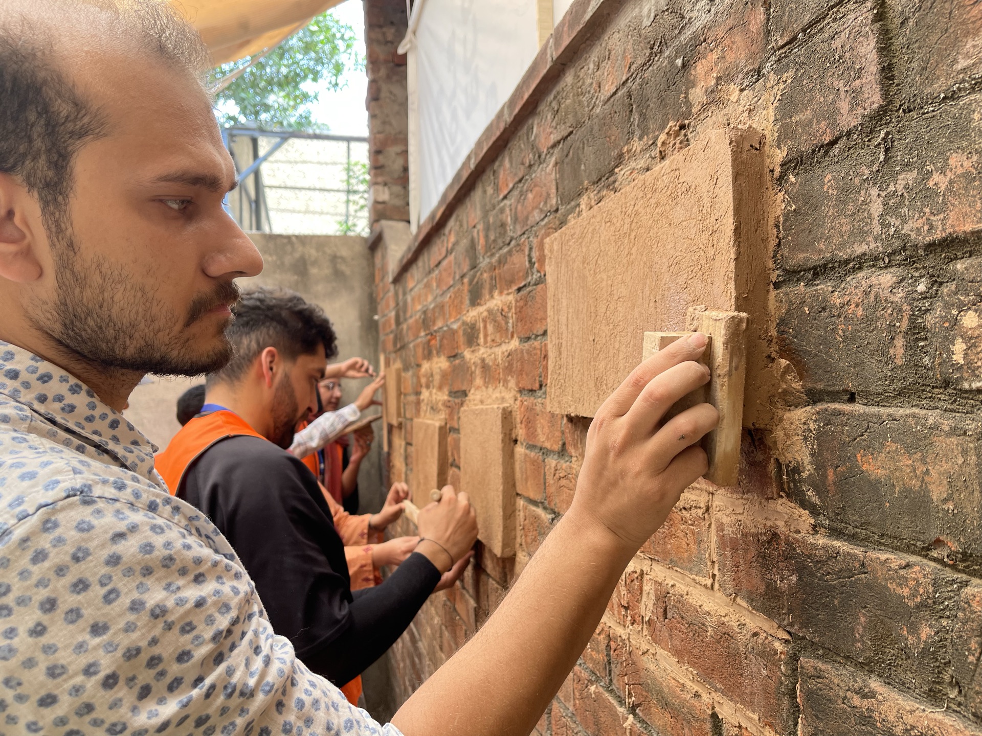 Hands-on lime practice with Lime Expert Ms. Catherine Woolfitt: mixing mortars, repointing, and casting lime slabs.